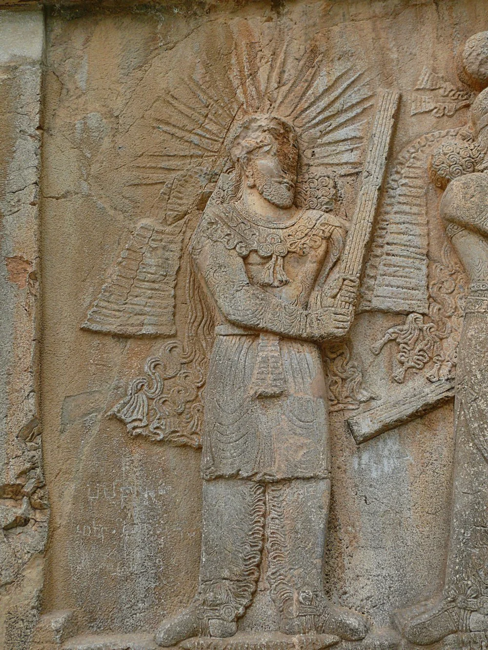 God Mithra on the rock relief of Shapour II at Taq-e Bustan  (309-79 BCE) /Wikimedia Commons