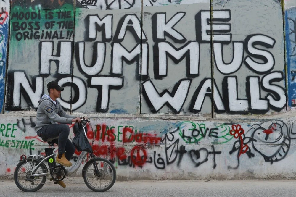 Political аnd Social Mural Paintings And Graffitis On The Israeli West Bank Barrier In Bethlehem, West Bank On March 13, 2018/ Artur Widak/NurPhoto/Legion-Media