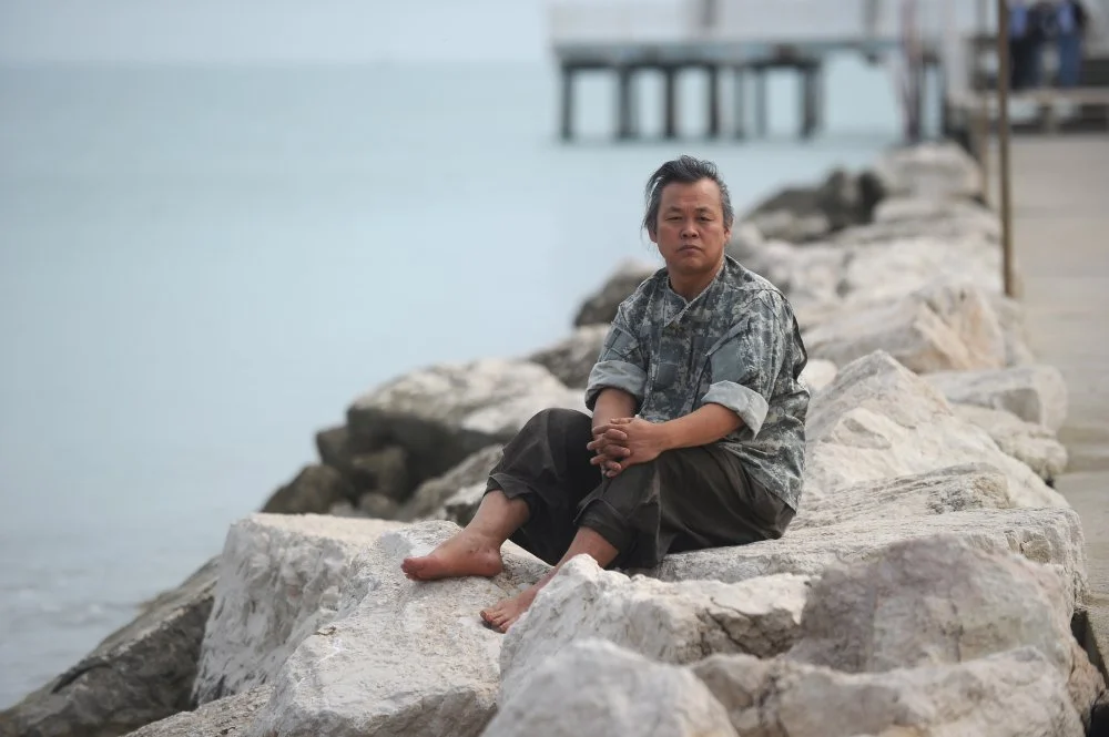 South Korean director Kim Ki-duk poses during a photo session at the 69th Venice Film Festival on September 5, 2012 at Venice Lido/ Tiziana Fabi/AFP/GettyImages