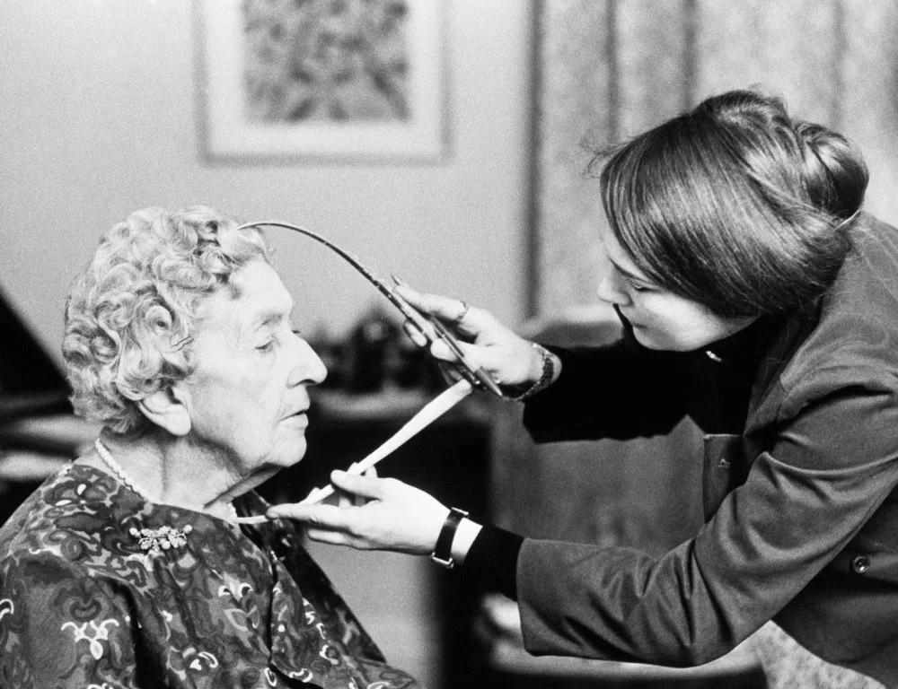 Employee takes measurements of agatha christie to make her wax figure/Getty Images