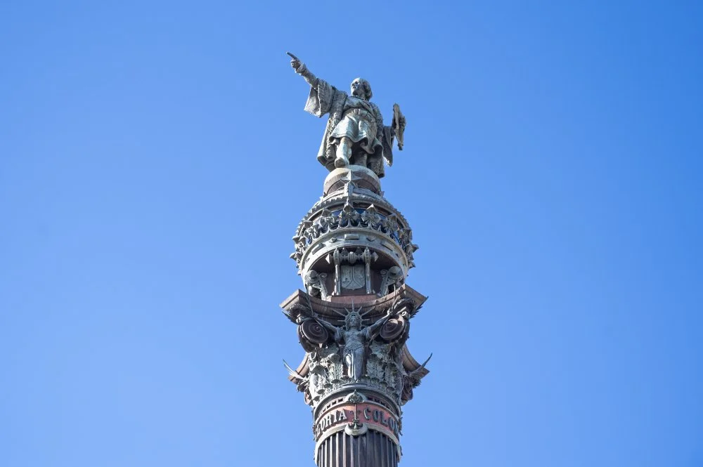 The Christopher Columbus Monument pointing towards the sea in a symbolic gesture, located at the lower end of La Rambla street in Barcelona/Xavi Lopez/Getty Images