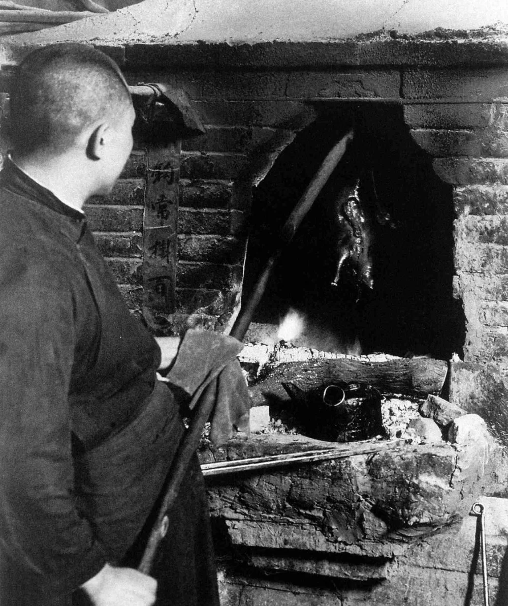 A Peking duck being roasted by a hung oven c. 1933/Wikimedia commons