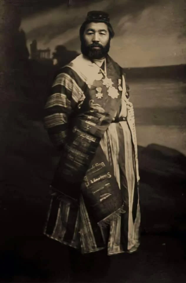 Photo of Kazhymukan Munaitpasov with beard in a cape/egemen.kz