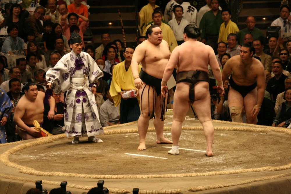Sumo wrestlers after the match/Alamy