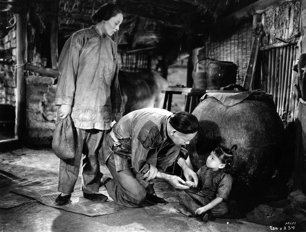 1937: Luise Rainer and Marcella Wong star with Paul Muni (1896-1967) in a scene from the film 'The Good Earth'/Hulton Archive/Getty Images