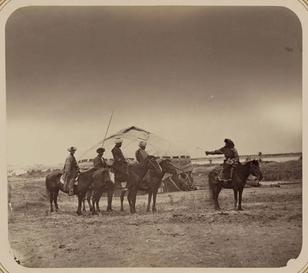 The woman is holding a whip and is looking back at the men. May be an example of the tradition of capturing or "kidnapping" a bride. Turkestan Album. 19 century/Wikimedia commons