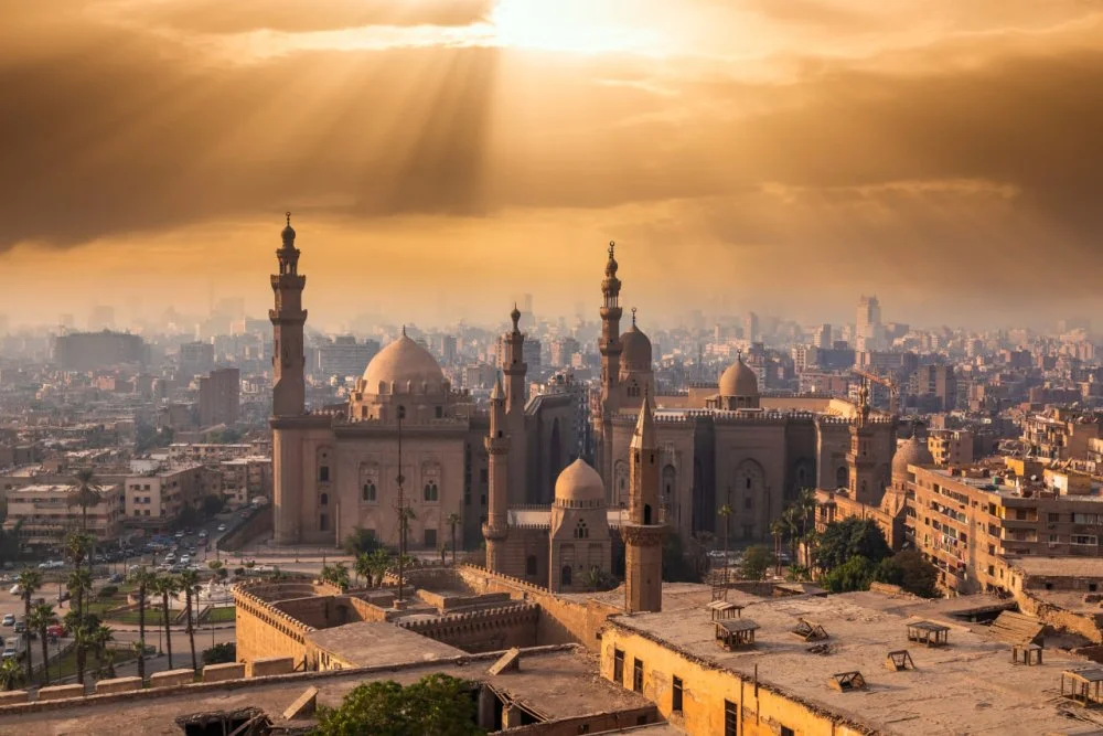 The famous view of Cairo at sunset. The Mosque-Madrasa of Sultan Hassan/Getty images