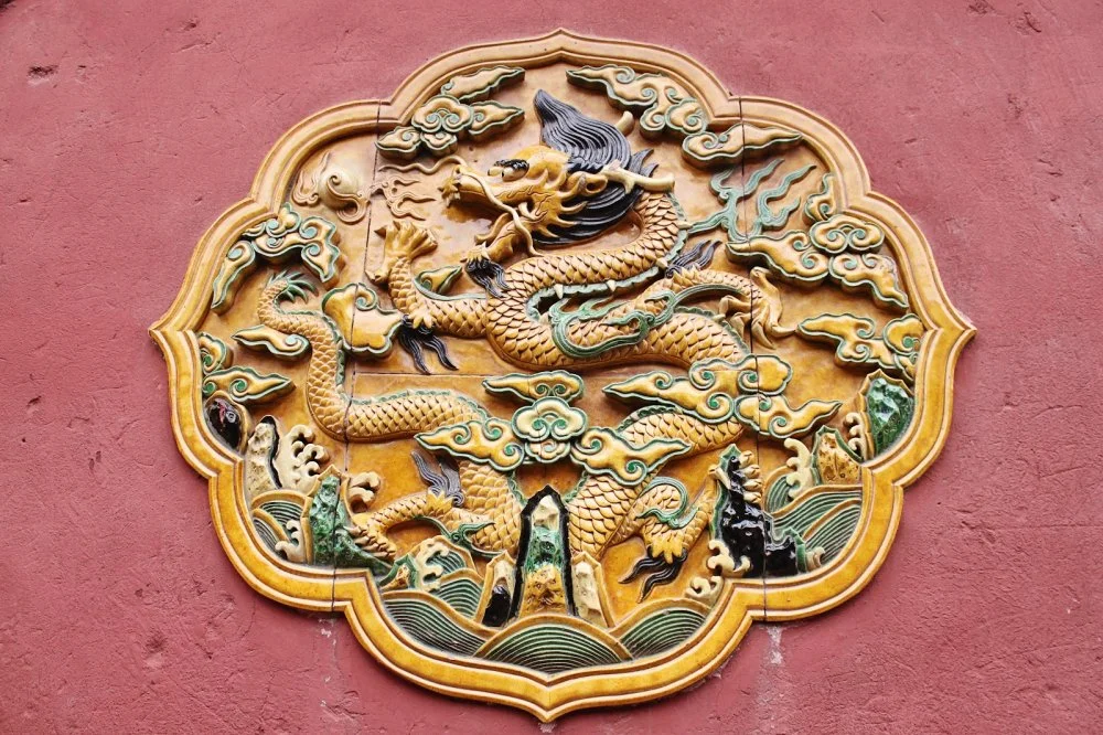 Yellow Dragon Ceramic Decoration Symbol Emperor Red Wall Gugong, Forbidden City Emperor's Palace, Beijing, China/Alamy