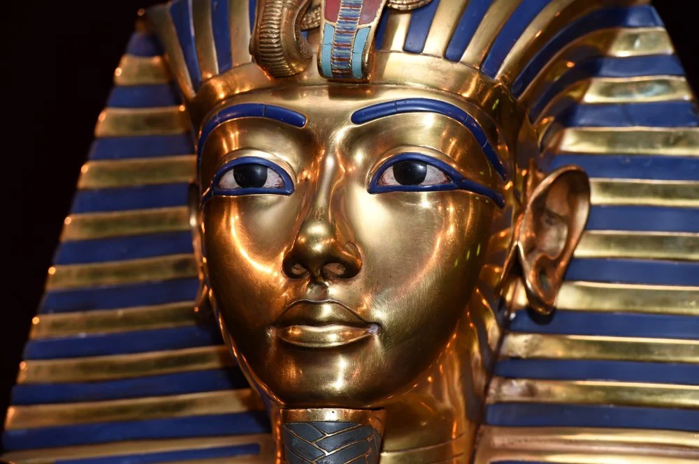 The burial mask of Egyptian Pharaoh Tutankhamun/Photo by Hannes Magerstaedt/Getty Images