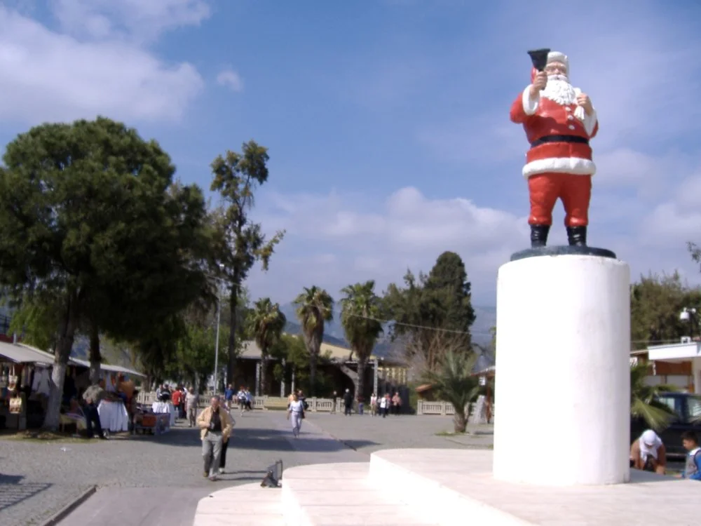 Santa Claus sculpture at square in front of the Saint Nicolas church in Demre, Turkey/Wikimedia Commons