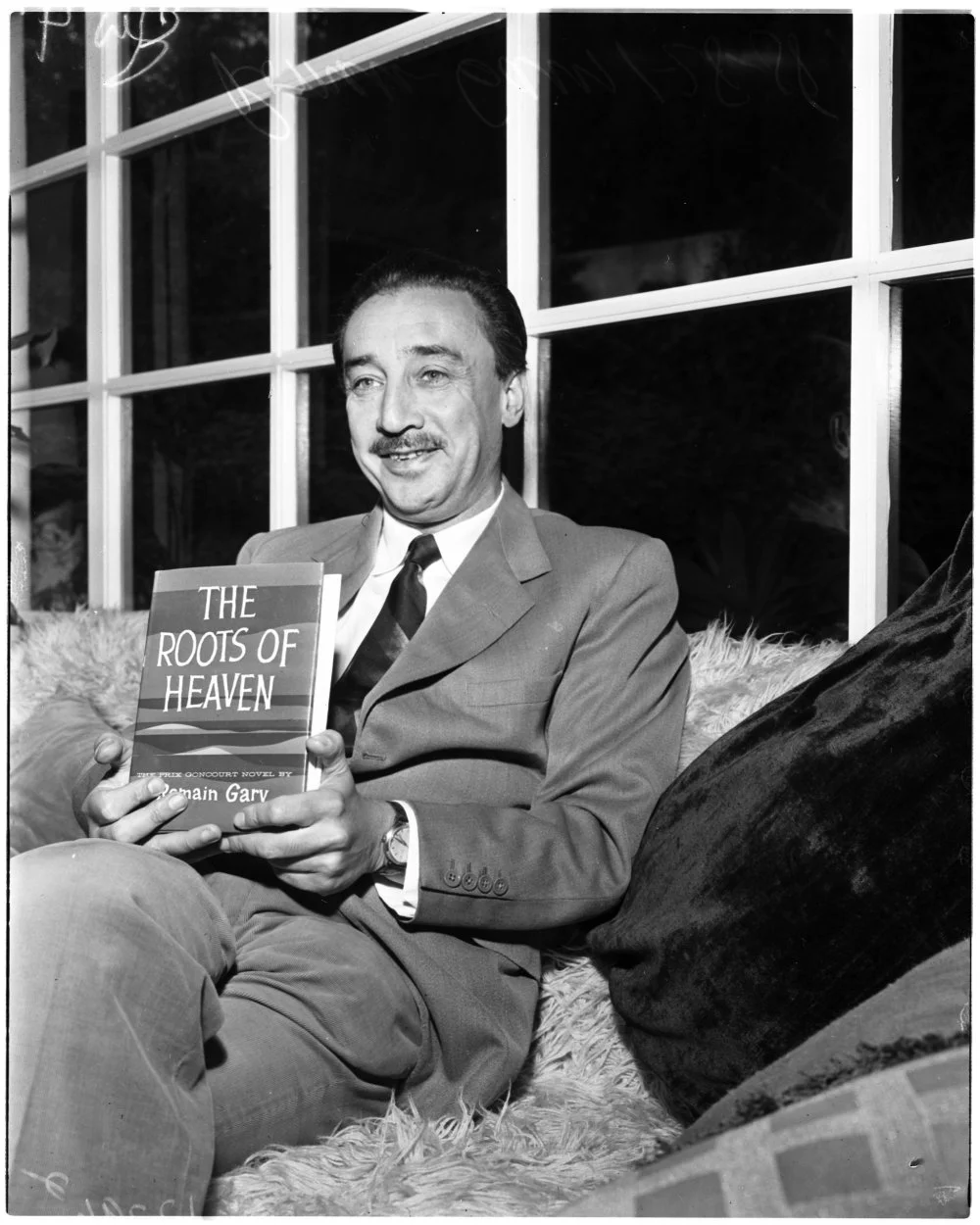 French consul general, Romain Gary (French consul general) with his book 'The Roots of Heaven', January 28, 1958/Getty Images