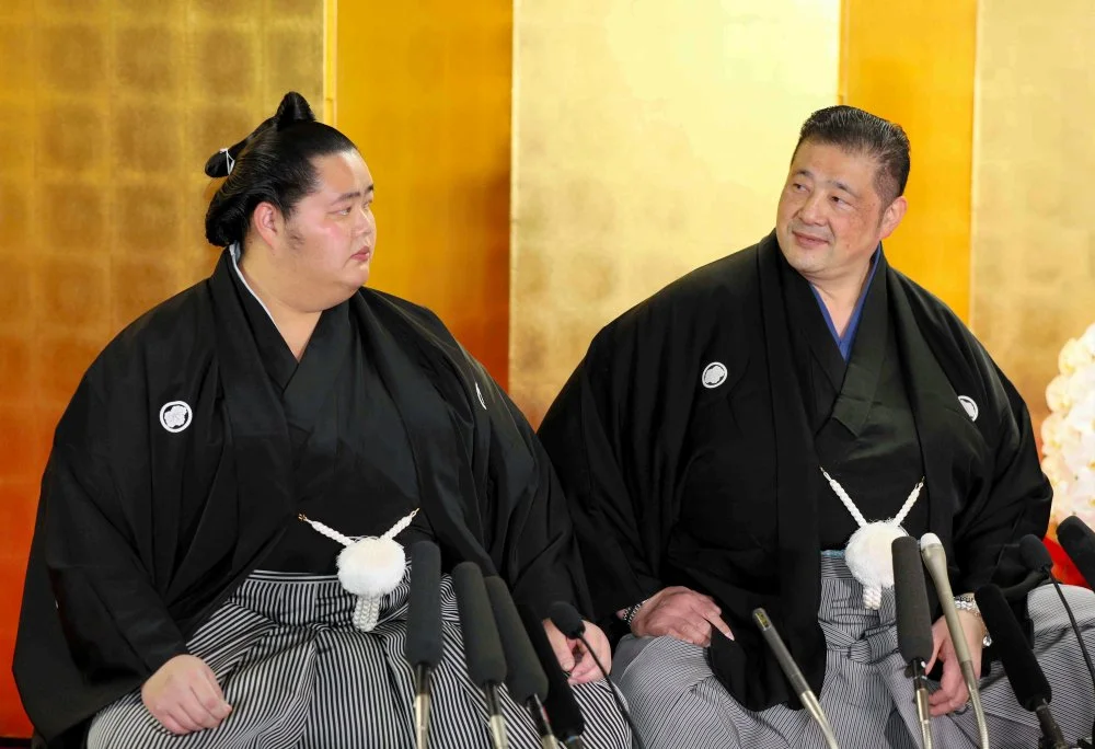 Sumo wrestler Kotonowaka (left) attends a press conference at Sadogatake stable in Matsudo. 2024/The Asahi Shimbun via Getty Images