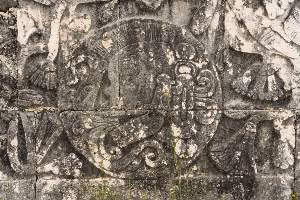 Stone bas relief carvings of ball players on the walls of the Great Ball Court in the ruins of the Great Mayan City of Chichen Itza, Yucatan, Mexico. The Pre-Hispanic City of Chichen-Itza is a UNESCO World Heritage Site./Jon G. Fuller, Jr./Alamy