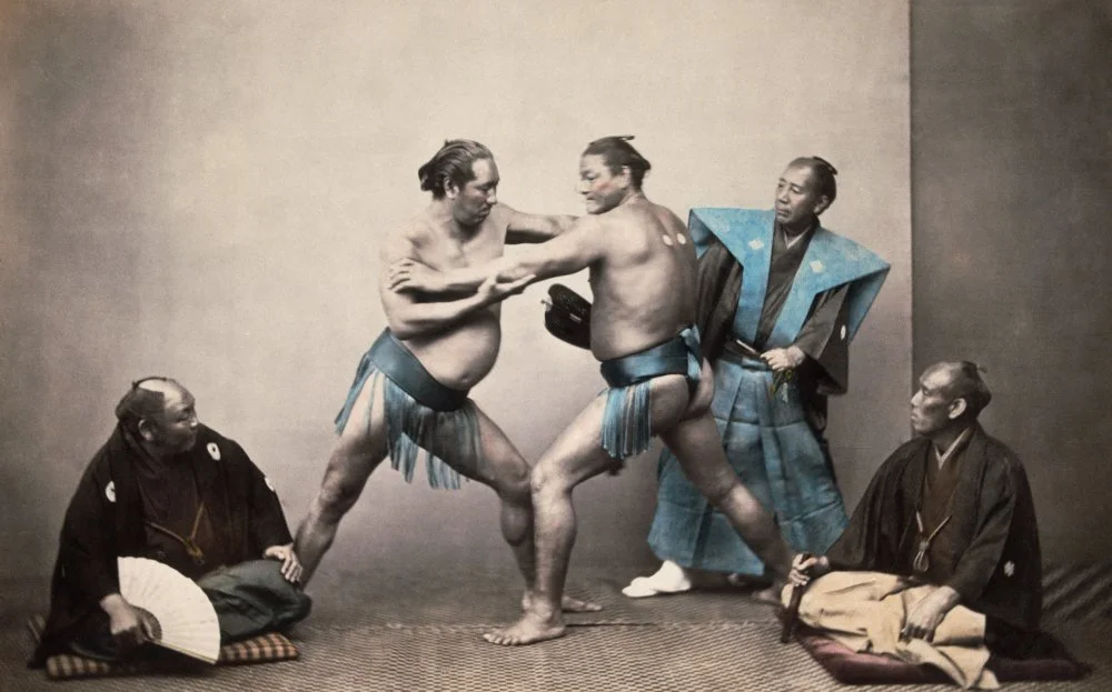 Japanese sumo wrestlers fight/Getty Images