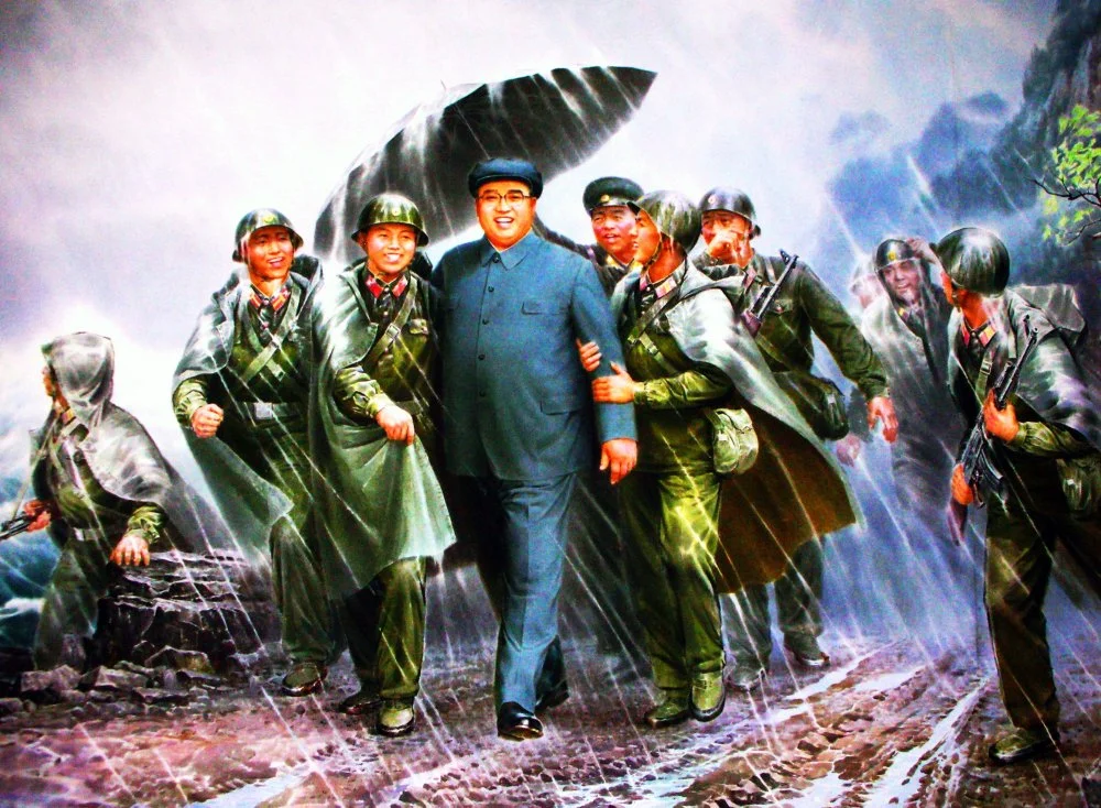 Ким Ир Сеннің сарбаздармен бірге келе жатқанын бейнелейтін Солтүстік Корея постері. 1985/Alamy