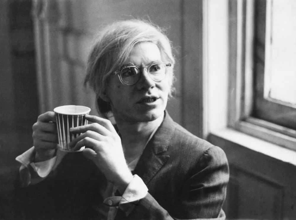 Andy Warhol (1928 - 1987) holding a paper cup, 9th August 1971/Pictorial Parade/Archive Photos/Getty Images