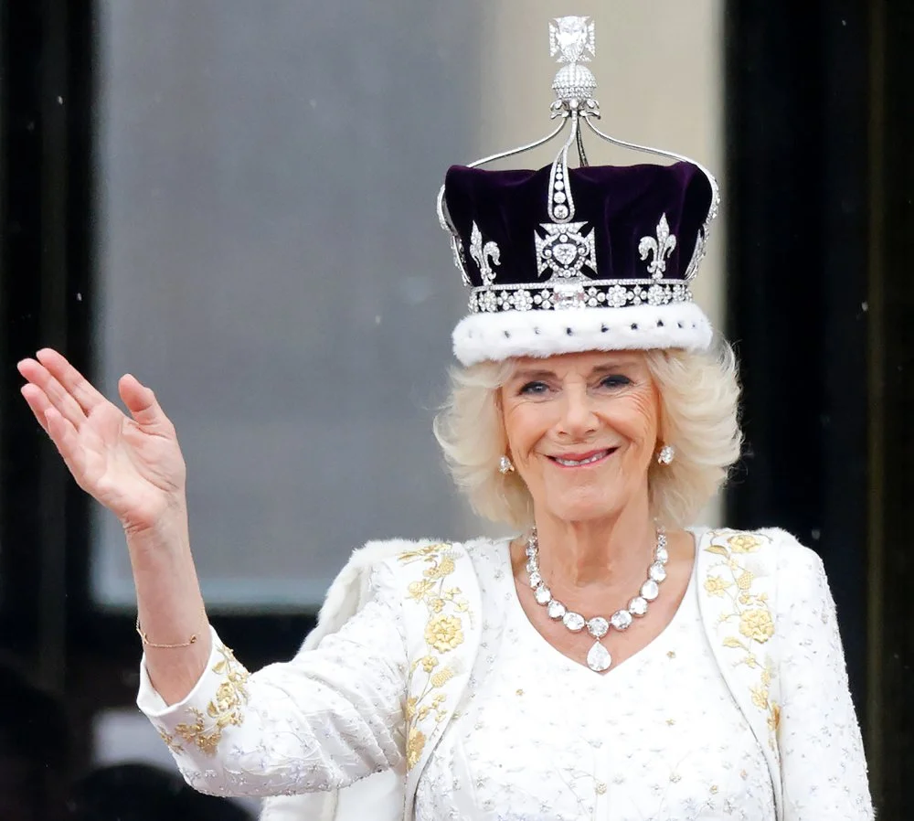 Queen Camilla watches an RAF flypast from the balcony of Buckingham Palace following her and King Charles III's Coronation at Westminster Abbey on May 6, 2023 in London, England/Getty Images