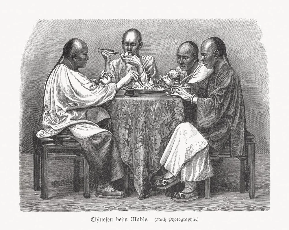 Chinese men at the meal, woodcut, published in 1897/Getty Images