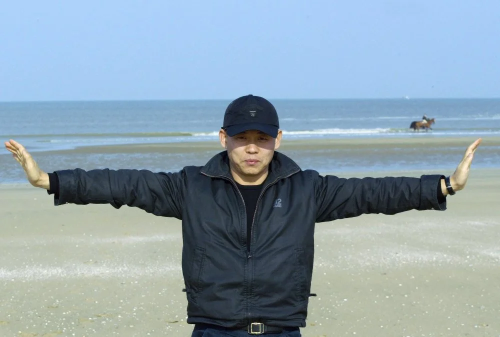 Korean director Kim Ki Duk gestures on the beach during the Asian Film Festival in Deauville, western France, 11 March 2004. His film "Spring, Summer, Fall, Winter.. and Springs" opens the festival/Jean-pierre muller/Afp/ Getty Images