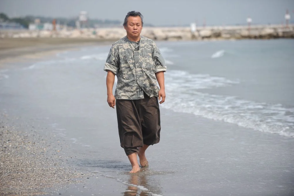 South Korean director Kim Ki-duk poses during a photo session at the 69th Venice Film Festival on September 5, 2012 at Venice Lido/ TIZIANA FABI/AFP/GettyImages