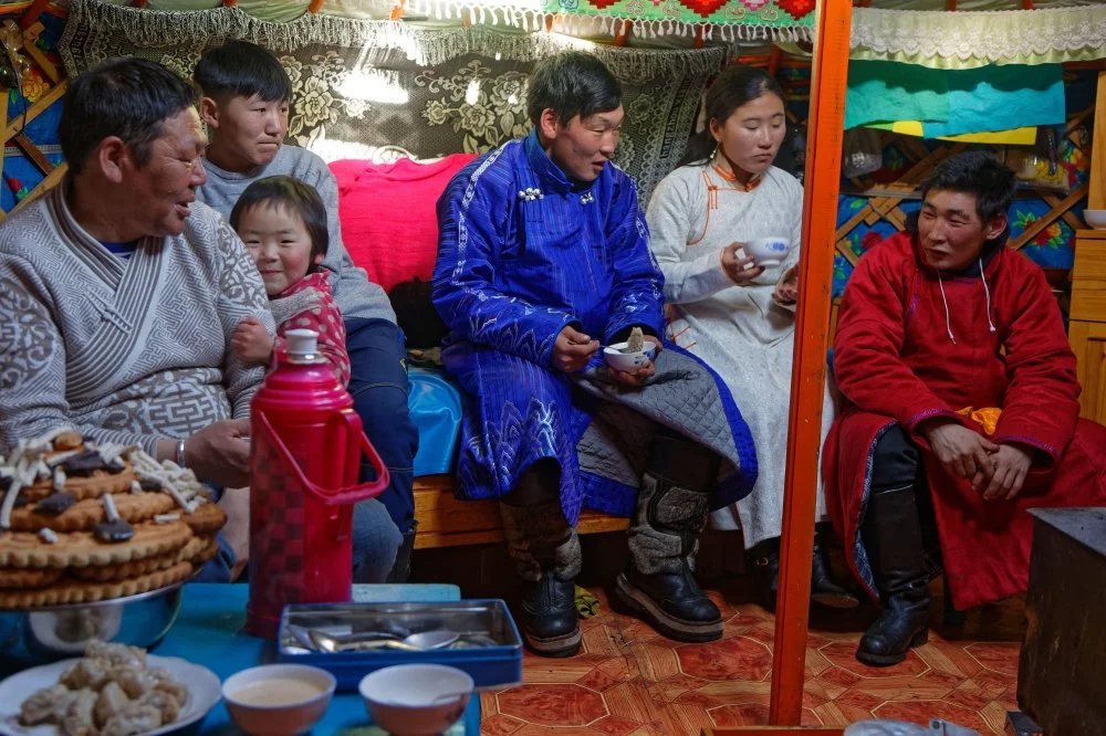 Mongolian people visit their family and friends in their yurts during Tsagaan Tsar, the mongolian new year/Alamy