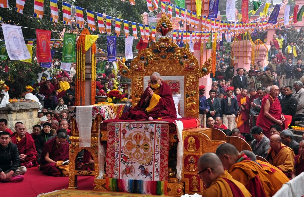 Tibetan spiritual leader the Dalai Lama prays at the Mahabodhi Temple premises along with other monks during the sixth day of the Kalachakra Festival in Bodhgaya on January 6, 2012. Kalachakra 2012, a festival of teachings and meditations will take place from January 1, 2012 for ten days in the northern Indian state of Bihar and will be attended by Tibetan spiritual leader the Dalai Lama/DIPTENDU DUTTA/AFP via Getty Images