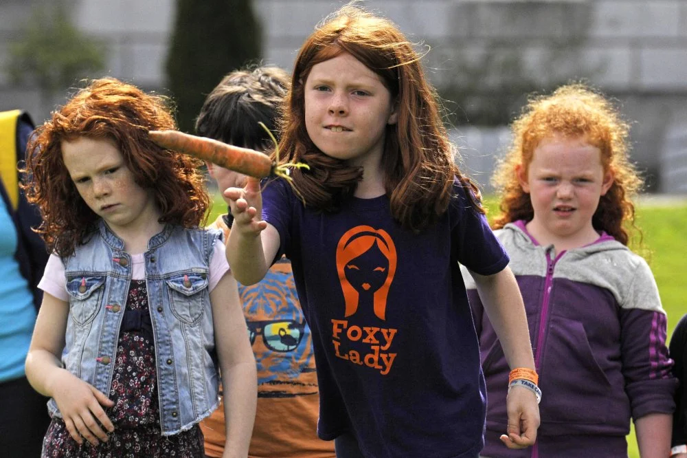 Children participate in the carrot throwing competition at the Irish Redhead Convention which celebrates everything to do with red hair held in the village of Crosshaven on August 23, 2015 in Cork, Ireland/Clodagh Kilcoyne/Getty Images