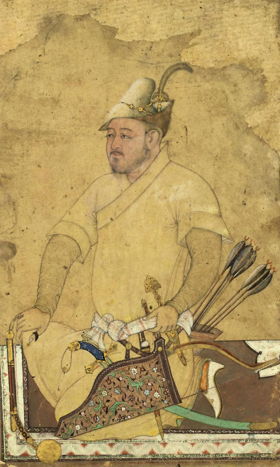 The heavily armed warrior (probably uzbek) with a very finely painted face kneels upon a medallion carpet wearing a robe with short sleeves and an adorned fur hat, a mace, daggers, bow and arrow and shamshir amongst his weapons. 16 century/Wikimedia Commons 