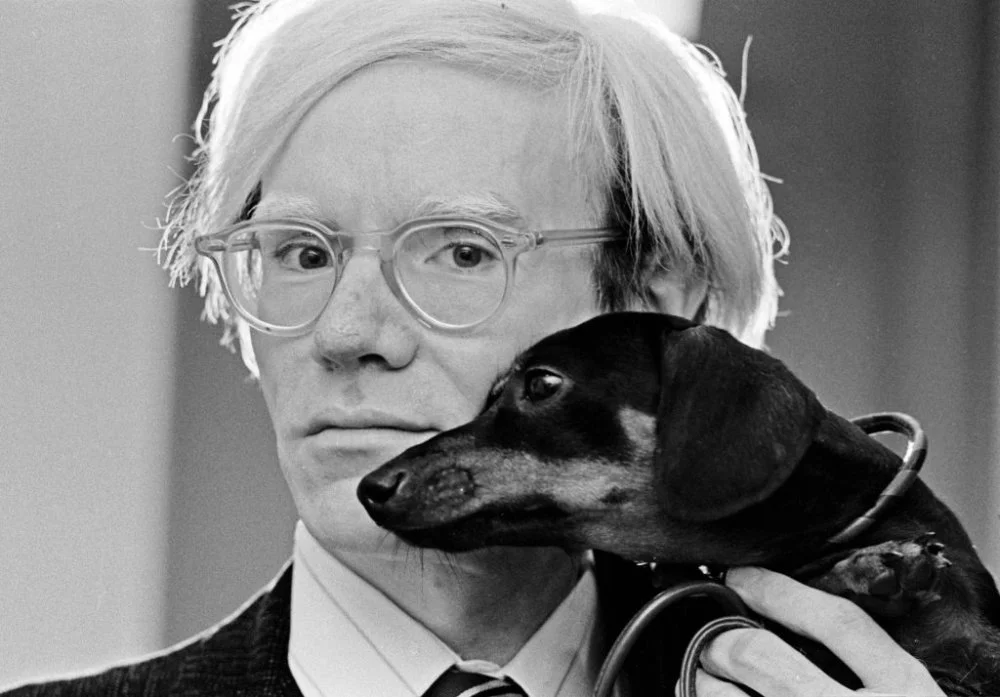 Andy Warhol poses with his beloved dachshund Archie in November 1973/Photo by Jack Mitchell/Getty Images