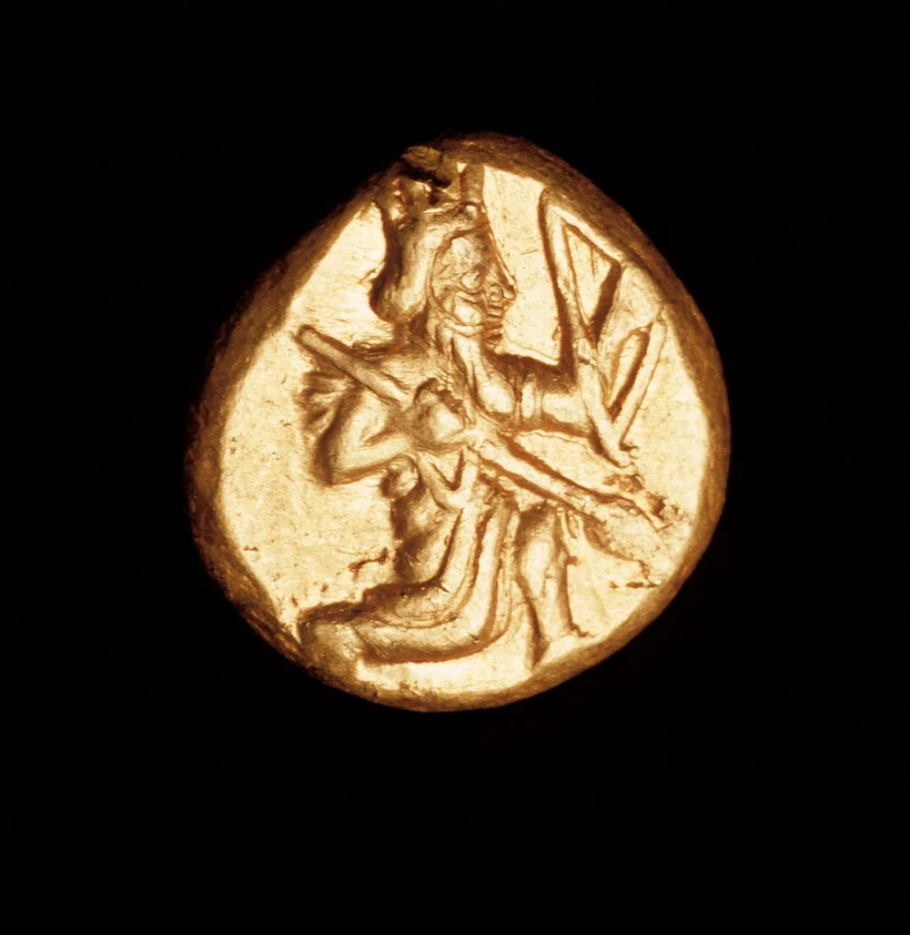 Rare Ancient Greek coin, Gold Persian Daric. Great King kneeling with bow circa 450BC/Getty Images