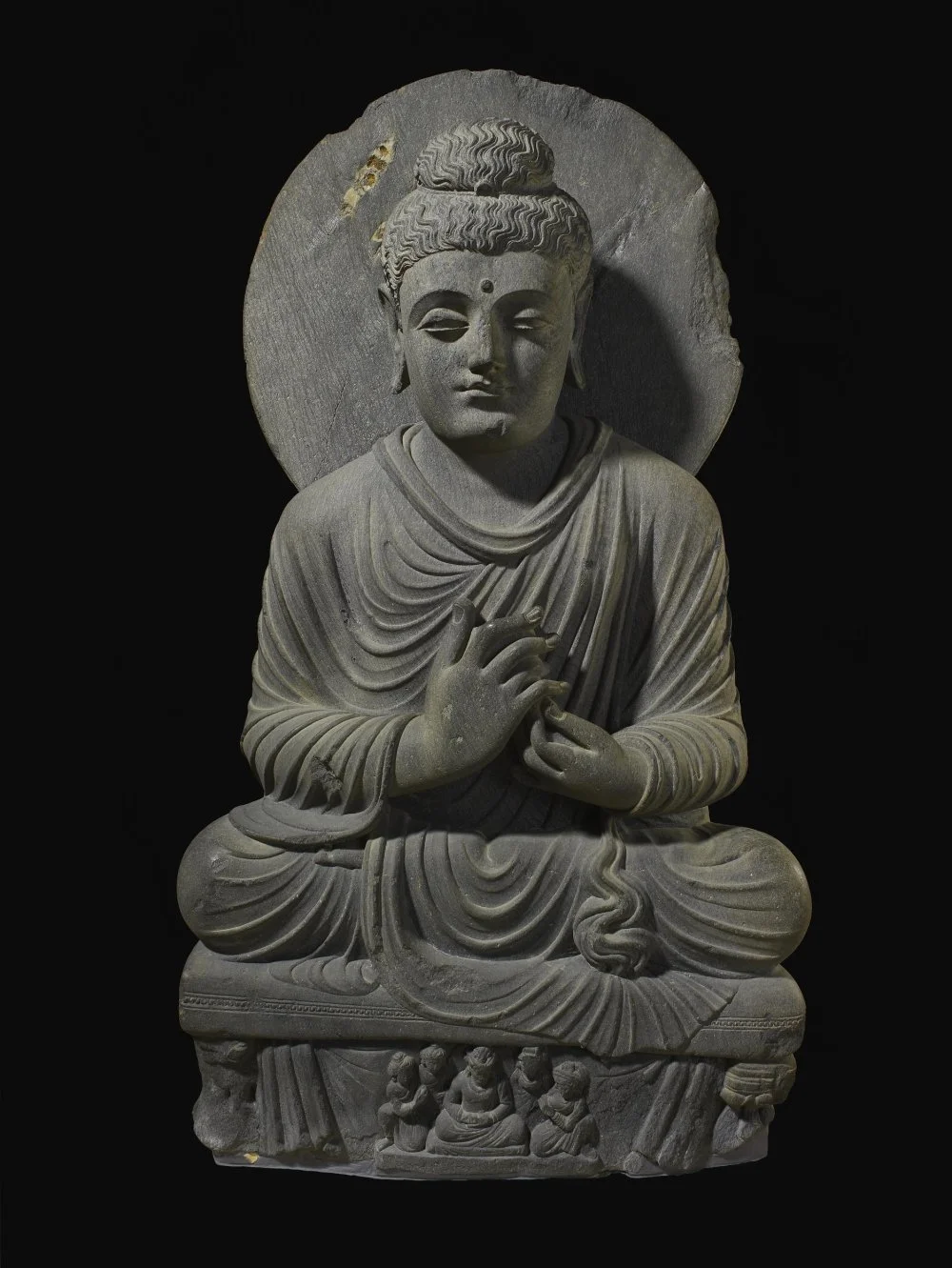 Sitting Buddha. Gandhara, India. 2nd-3rd century AD / The Trustees of the British Museum