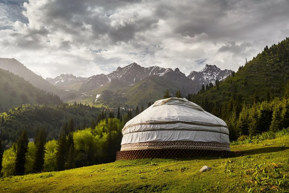 White Yurt at green mountain valley in Almaty, Kazakhstan/Alamy 