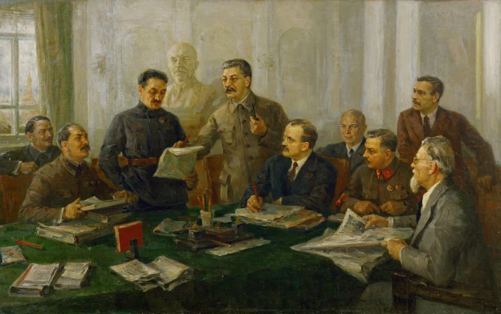 Meeting of the Central Committee of the Soviet Communist Party, 1939. From left to right: Mikojan (standing), Stalin, Molotov, Kalinin (sitting, far right). / Modorow Fjodor./Getty Images